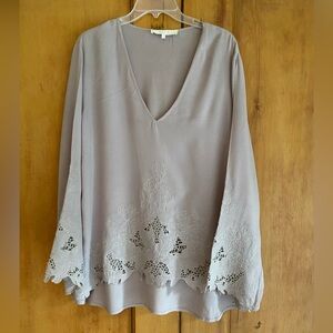 Light lavender colored long sleeve blouse with cut outs